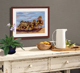 Pastel portrait print of 7 ducklings by the water framed in mahogany and a white mat  hanging over a country side bar.  Rendered in a contemporary style using bold strokes and bright colors by award winning artist Kathie Miller.