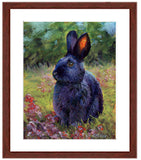 Pastel portrait of a black rabbit sitting among the wildflowers. Print with a mahogany frame and 2” white mat. Rendered in a contemporary style using bold strokes and bright colors by award winning artist Kathie Miller. 