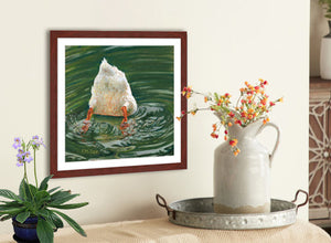 Pastel portrait of a white duck dunking for dinner. Print with mahogany frame and a 2” white mat hanging over a country kitchen sideboard.  Rendered in a contemporary style using bold strokes and bright colors by award winning artist Kathie Miller.