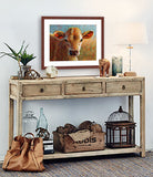 A mock up photo of a rustic entrance hall. Hung on the wall is a print of my painting “Brandy-Jersey Calf” by award winning artist Kathie Miller. The print has a mahogany frame and white mat. This is a contemporary pastel portrait of a Jersey calf rendered in bold expressive strokes and bright colors. 