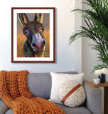 Funny pastel portrait of a donkey in a cozy sitting area .  Rendered in a contemporary style using bold strokes and bright colors by award winning artist Kathie Miller.