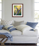 Pastel portrait of a blue tit in the morning light. Print with mahogany frame and a white mat  hanging in a living room with a white couch and blue and white throw pillows.  Rendered in a contemporary style using bold strokes and bright colors by award winning artist Kathie Miller.