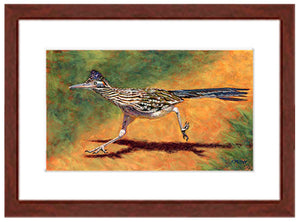 Pastel painting of a greater roadrunner in full run with a mahogany frame and white mat. Rendered in a contemporary style using bold strokes and bright colors by award winning artist Kathie Miller. 