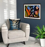  Monarch Butterfly wing abstract painting hanging in a cozy sitting corner by wildlife artist Kathie Miller.
