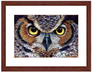 Pastel portrait print of a great horned owl with a mahogany frame and 2” white mat. Rendered in a contemporary style using bold strokes and bright colors by award winning artist Kathie Miller. 