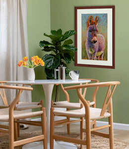 Pastel portrait of a donkey in a small dining room .  Rendered in a contemporary style using bold strokes and bright colors by award winning artist Kathie Miller.