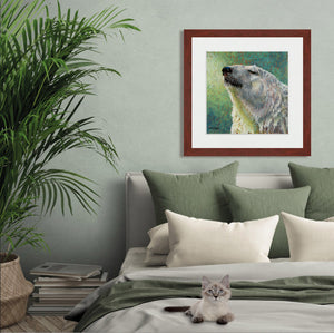 A mock up photo of a elegant bedroom. Hung on the wall is a print of my painting “Something in the Air-Polar Bear” by award winning artist Kathie Miller. The print has a mahogany frame and white mat. This is a contemporary pastel portrait of a polar bear rendered in bold expressive strokes and bright colors. 